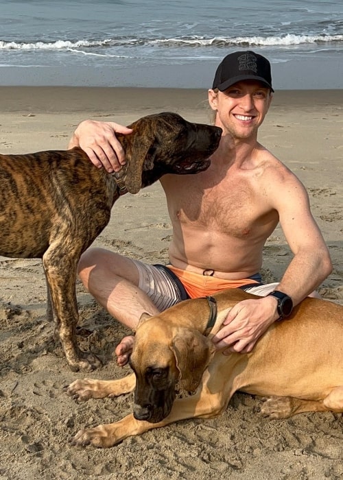 Brent Goble as seen in a picture with his pet dogs while at the beach in Vagator, Goa in January 2023