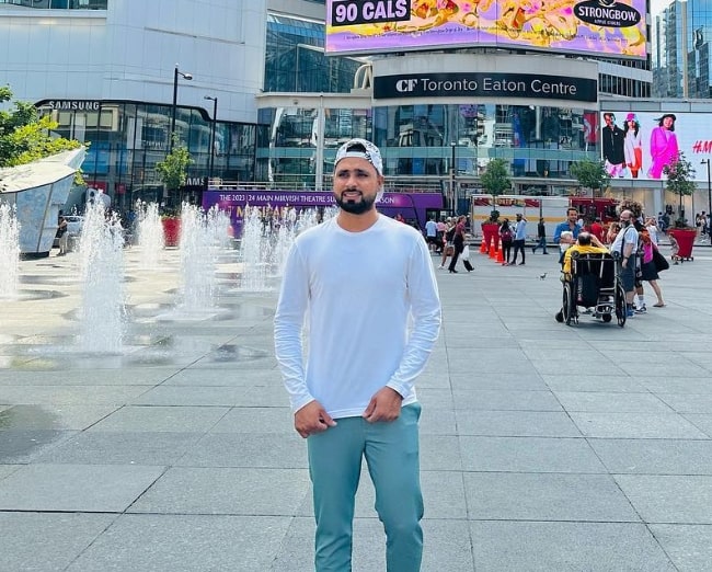 Faheem Ashraf as seen while posing for a picture at Yonge–Dundas Square in Toronto, Canada in July 2023