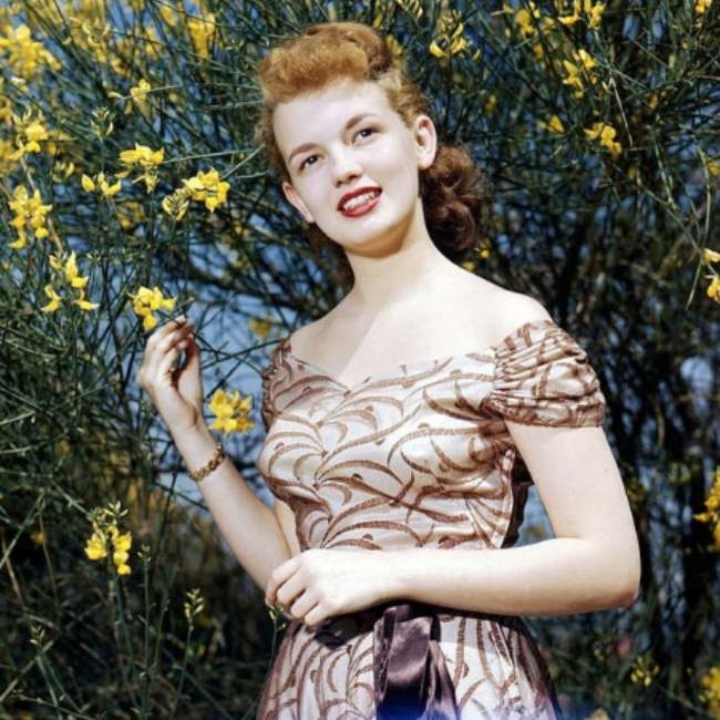 Joan Evans as seen smiling in a colored picture