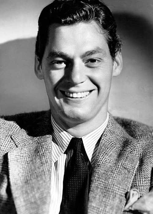 Johnny Weissmuller as seen while smiling in a studio publicity photo, c. 1940s