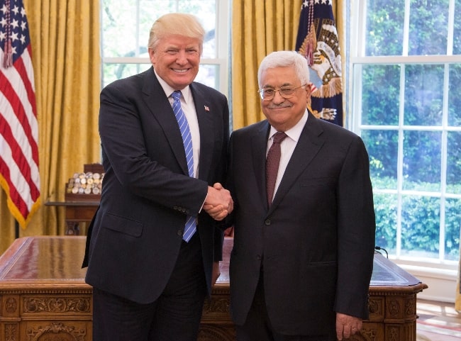 Mahmoud Abbas (Right) posing for a picture with President Donald Trump in the Oval Office of the White House in Washington, D.C. in May 2017