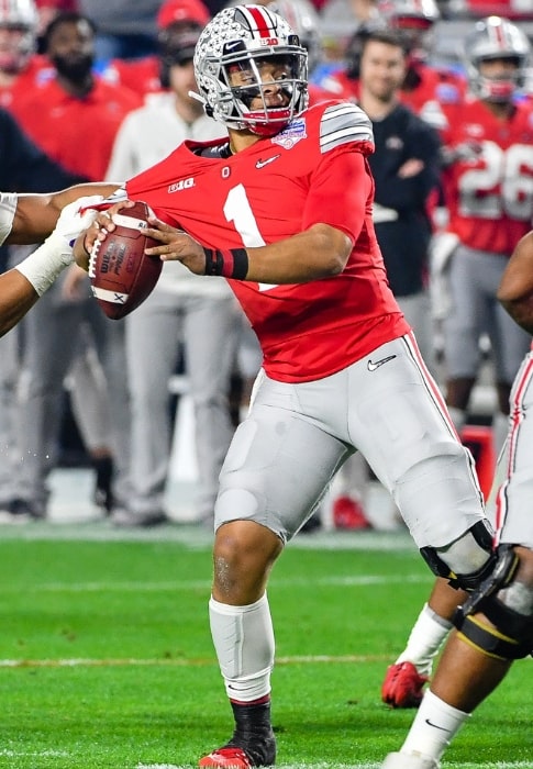 Justin Fields with the Ohio State Buckeyes as seen while attempting a pass during a game against the Clemson Tigers in the 2019 Fiesta Bowl