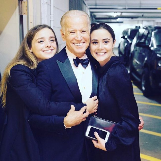 Naomi Biden as seen posing with her grandfather President Joe Biden and sister Finnegan in 2017