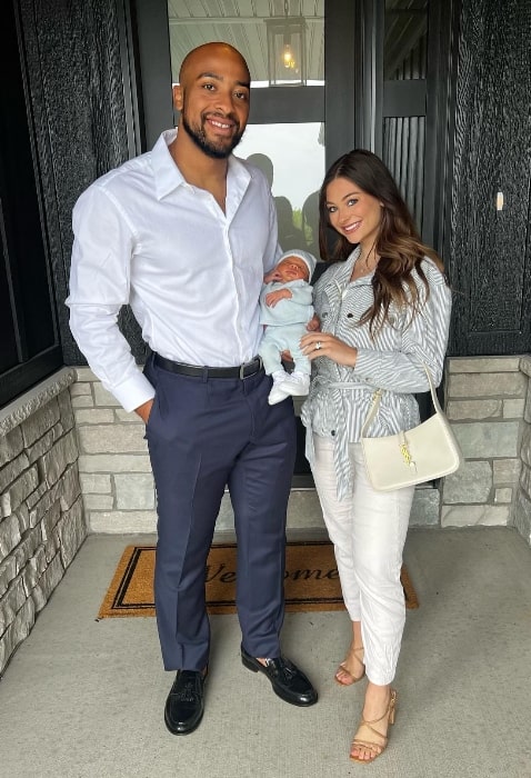 AJ Dillon as seen while posing for a picture with his wife Gabrielle and their child in Green Bay, Wisconsin