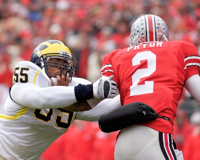 Brandon Graham (Left) with the University of Michigan Wolverines as seen while attempting to sack quarterback Terrell Pryor during a game against the Ohio State Buckeyes on November 22, 2008