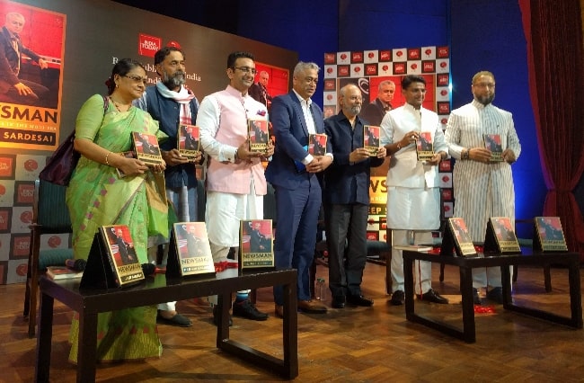 From Left to Right - Kakoli Ghosh Dastidar, Yogendra Yadav, Gaurav Bhatia, Rajdeep Sardesai, Naresh Gujral, Sachin Pilot, and Asadudin Owaisi during the book launch of Sardesai's book 'Newsman' in 2018