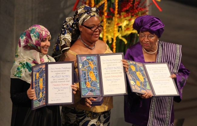 From Left to Right - Tawakkul Karman, Leymah Gbowee, and Ellen Johnson Sirleaf as seen while displaying their awards during the presentation of the Nobel Peace Prize on December 10, 2011