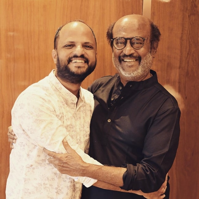 Jude Anthany Joseph (Left) as seen while smiling for a picture with Rajinikanth