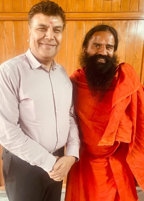 Ramdev (Right) as seen while posing for a picture with Manoj Tyagi in March 2023