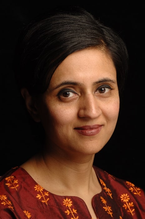 Sagarika Ghose as seen while smiling in a picture in December 2005