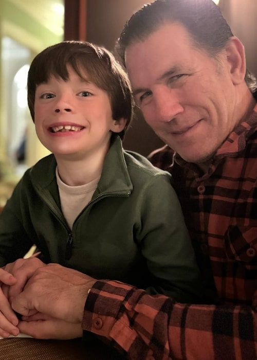 Thomas Ravenel smiling for a picture while having dinner with his son in December 2023
