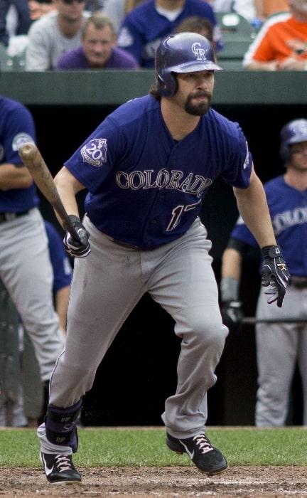 Todd Helton as seen with the Colorado Rockies while running to first base after a hit during a game on August 18, 2013