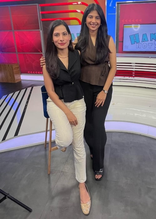 Anushka Rathod as seen in a picture taken with news anchor Ankita Saxena on the set of ET Now in November 2023