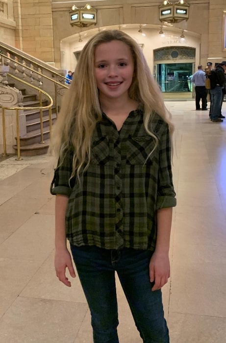 Cameron Seely as seen while smiling for the camera at the Grand Central Terminal in Midtown Manhattan, New York City in December 2019