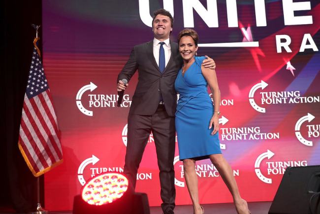 Charlie Kirk and Kari Lake as seen speaking at the Unite & Win Rally at the Arizona Financial Theatre in August 2022