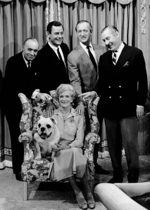 From Left to Right - Charles Boyer, Gig Young, David Niven, and Robert Coote with Gladys Cooper (sitting) posing for a cast photo of the television program 'The Rogues'