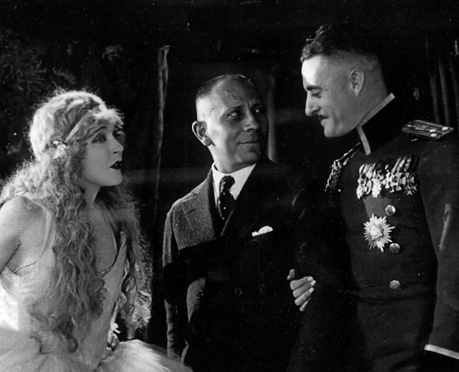 From Left to Right - Mae Murray, Erich von Stroheim, and John Gilbert as seen on the set of 'The Merry Widow' (1925)
