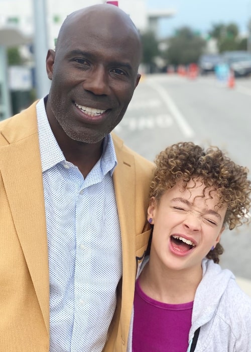 Hannah Love Lanier as seen while posing for a picture with Terrell Davis at Miami Beach Convention Center in Miami Beach, Florida in 2020