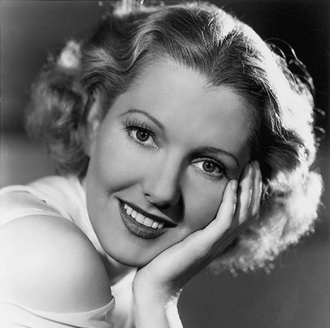 Jean Arthur as seen while smiling in a publicity photo in the mid-1930s