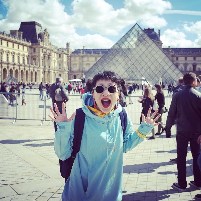 Meng'er Zhang as seen while posing for a picture while enjoying her time in Paris, France in 2018