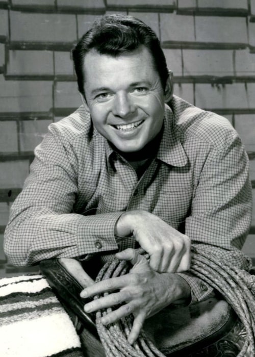 Audie Murphy as Tom Smith from the television program Whispering Smith in 1961